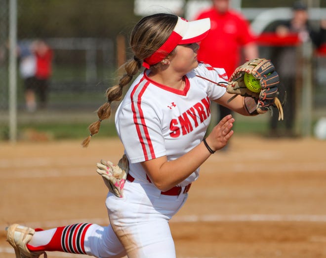 Smyrna's Savanah Arnold is pulled off first base on a throw as Polytech rallies in the fourth inning of Polytech's 8-3 win at Smyrna High School, Thursday, April 18, 2024.