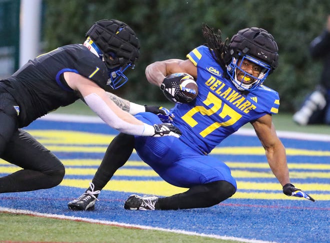 Delaware running back Jo'Nathan Silver gets in the end zone as he is tackled by linebacker Ty Davis during the Blue and White Spring Game at Delaware Stadium, Friday, April 19, 2024.