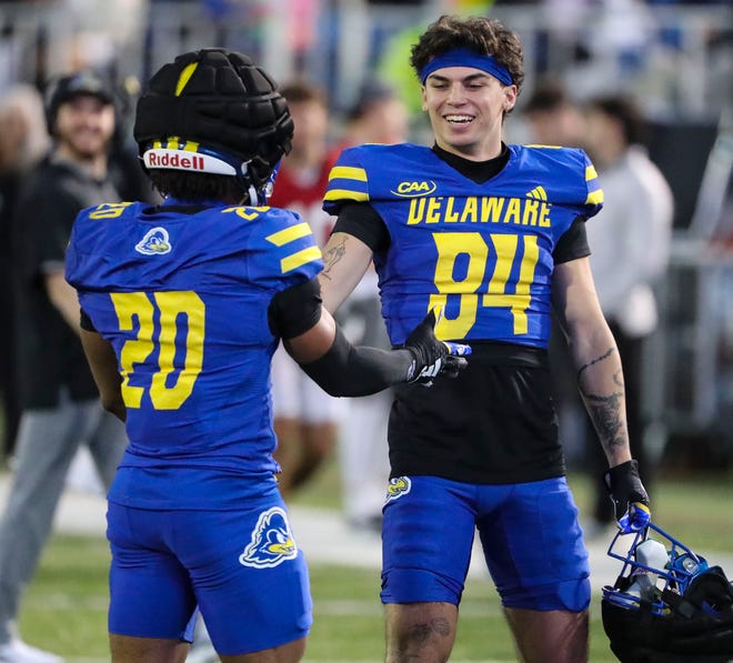 Delaware wide receiver Ja'Carree Kelly (20) is greeted by fellow receiver Santino Correa after the offense scored during the Blue and White Spring Game at Delaware Stadium, Friday, April 19, 2024.