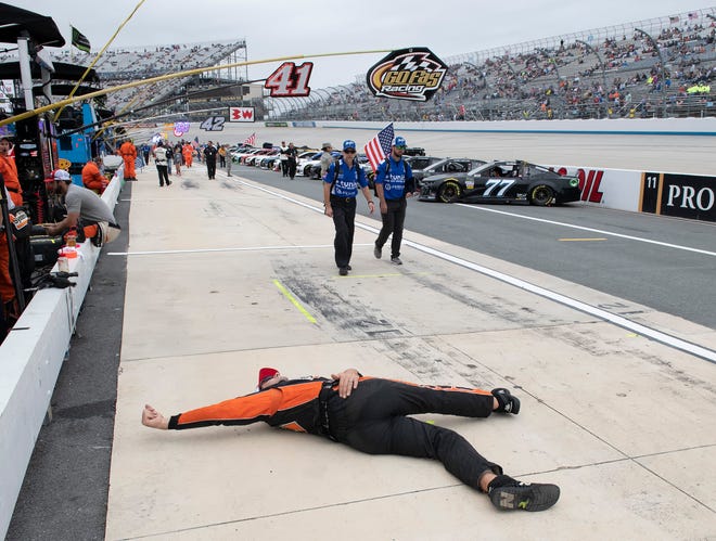 Ray Gallahan, jack man for Corey Lajoie, stretches on pit road before the NASCAR Cup Series playoff auto race, Sunday, Oct. 6, 2019, at Dover International Speedway in Dover.