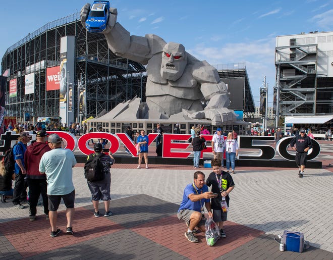 NASCAR fans take photos in front of Miles the Monster before the Drydene 400 - Monster Energy NASCAR Cup Series playoff auto race, Sunday, Oct. 6, 2019, at Dover International Speedway in Dover.