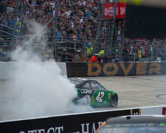 Kyle Larson No. (42) does a burn out after winning the Drydene 400 - Monster Energy NASCAR Cup Series playoff auto race, Sunday, Oct. 6, 2019, at Dover International Speedway in Dover.