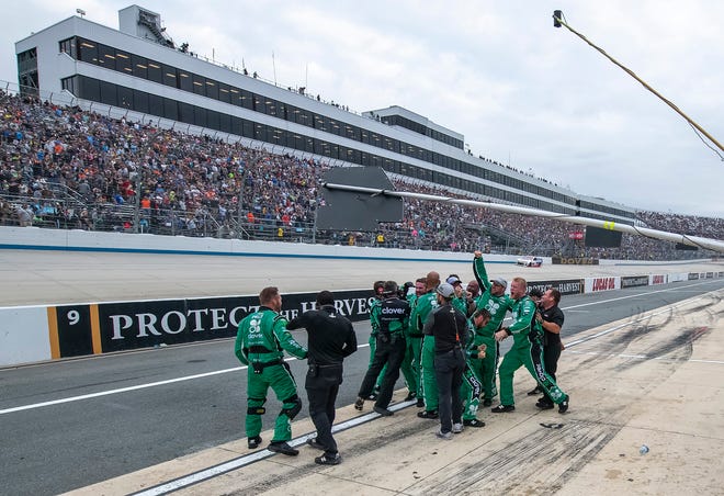 Kyle Larson's team celebrates on pit road after he won the NASCAR Cup Series playoff auto race Sunday, Oct. 6, 2019, at Dover International Speedway in Dover.