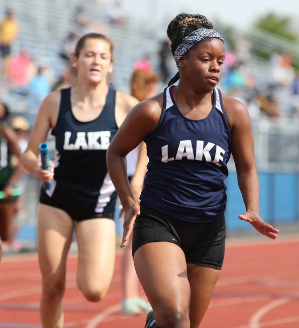 Lake Forest's Jessica Tyndall rushes to hand off to teammate Michelle Marklandon as their team wins the Division II 4x200 meter relay on the second and final day of the DIAA state high school track and field championships Saturday, May 22, 2021 at Dover High School.