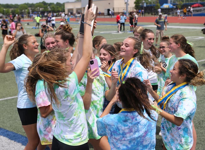 The St. Mark's girls' team celebrates taking the DIAA state high school Division II title championship Saturday, May 22, 2021 at Dover High School.