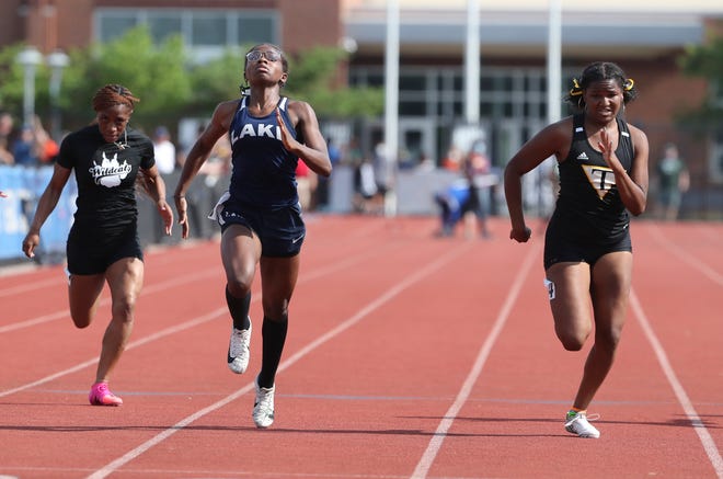 Lake Forest's Cierra Young (second from left) wins the Division II 100 meter dash ahead of second place finisher Vanessa Howard of Tatanll (right) and fifth place's Deja Curry of Howard on the second and final day of the DIAA state high school track and field championships Saturday, May 22, 2021 at Dover High School.