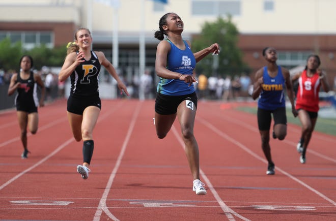 St. Georges' Charlee Crawford crosses the finish line first to earn the Division I 200 meter dash title on the second and final day of the DIAA state high school track and field championships Saturday, May 22, 2021 at Dover High School.