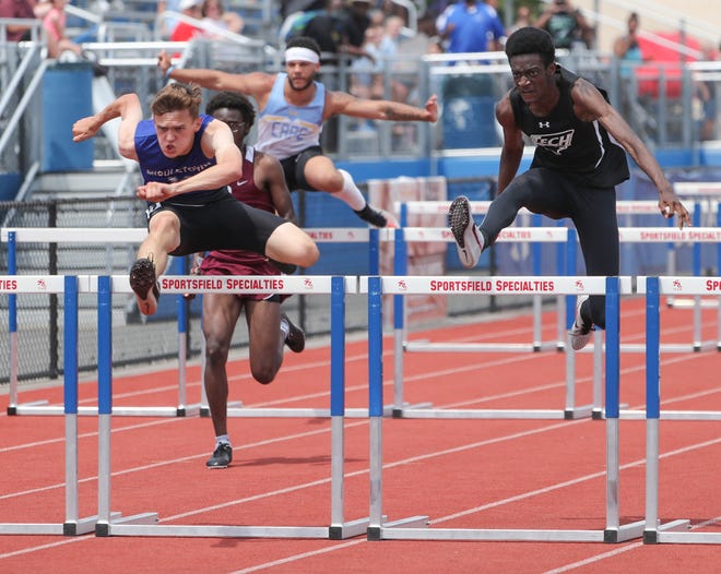 Middletown's Ryan Wallace (left) wins the Division I 110 meter hurdles final ahead of second place finisher Yougendy Mauricette of Sussex Tech on the second and final day of the DIAA state high school track and field championships Saturday, May 22, 2021 at Dover High School.