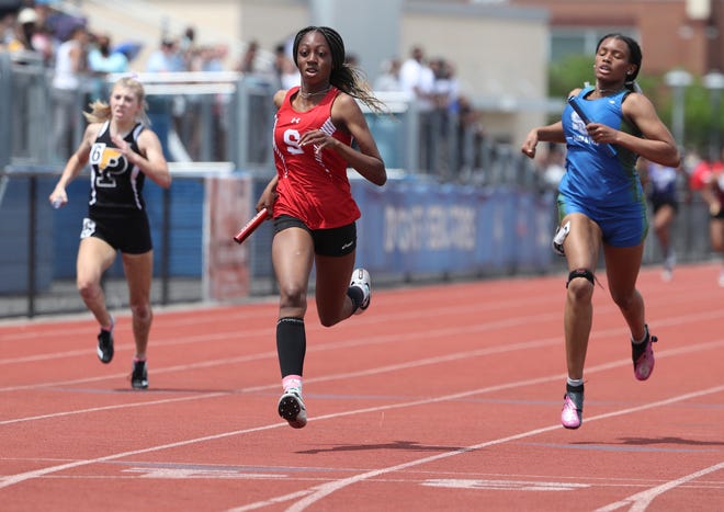 Smyrna's Elise Carter (center) anchors her team in its win of the Division I 4x200 meter relay on the second and final day of the DIAA state high school track and field championships Saturday, May 22, 2021 at Dover High School.