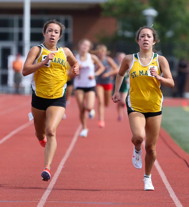 St. Mark's Stephanie Herrera (left) and Tiffany Herrera finish in the top two spots in the Division II 1600 meter run on the second and final day of the DIAA state high school track and field championships Saturday, May 22, 2021 at Dover High School.