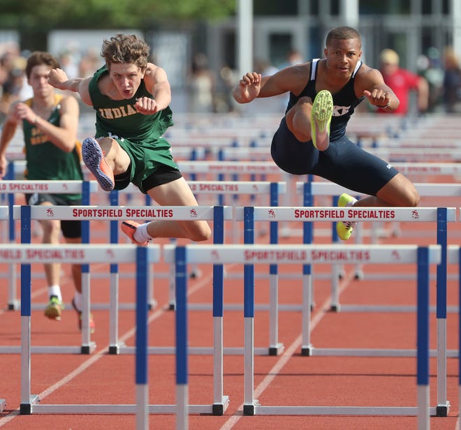 Lake Forest's Jalen Morris (right) holds off Indian River's Cole Brickman for the state title in the 110 meter hurdles on the second and final day of the DIAA state high school track and field championships Saturday, May 22, 2021 at Dover High School.