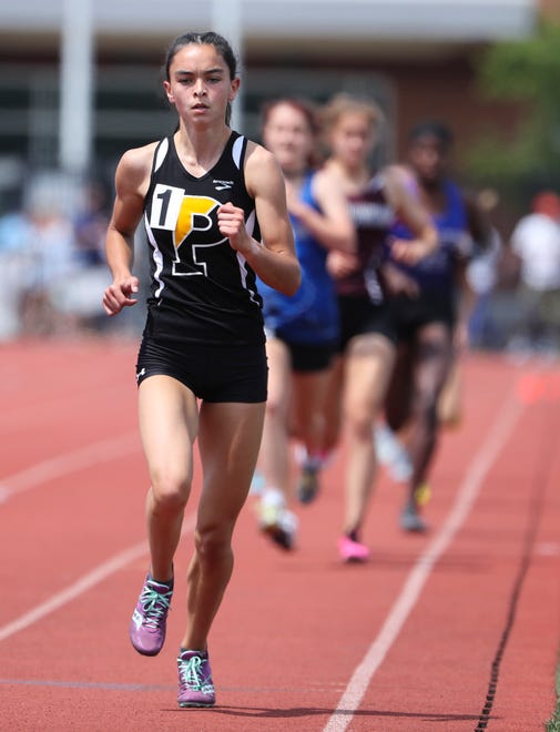 Katie Dorsey of Padua leads the field en route to winning the Division I 1600 meter race on the second and final day of the DIAA state high school track and field championships Saturday, May 22, 2021 at Dover High School.