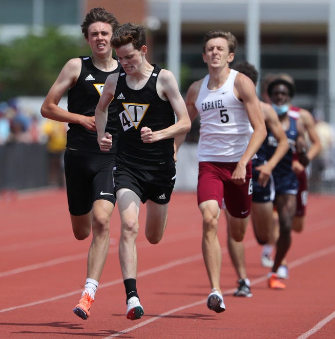 Tatnall's Nicolas Pizarro holds off teammate Declan McDonnell (second place) and Caravel's Michael Anderson (third) to win the Division II 800 meter race on the second and final day of the DIAA state high school track and field championships Saturday, May 22, 2021 at Dover High School.