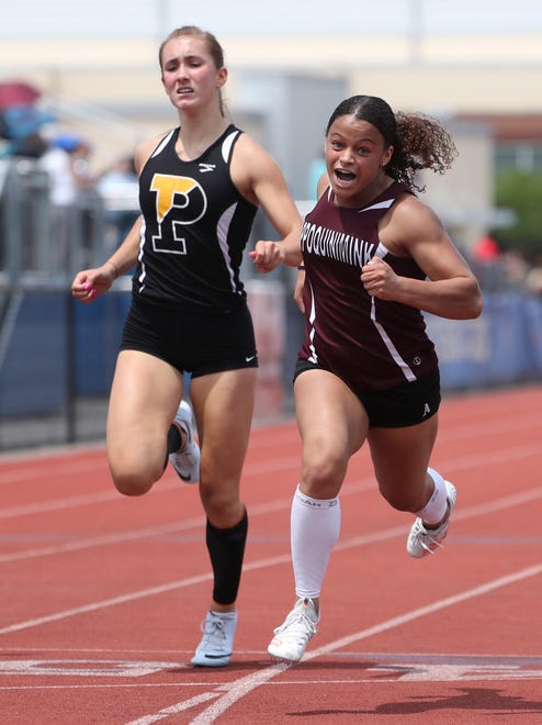 Appoquinimink's Delaney Brooks (right) wins the Division I 100 meter dash final as Juliana Balon of Padua trails on the second and final day of the DIAA state high school track and field championships Saturday, May 22, 2021 at Dover High School.