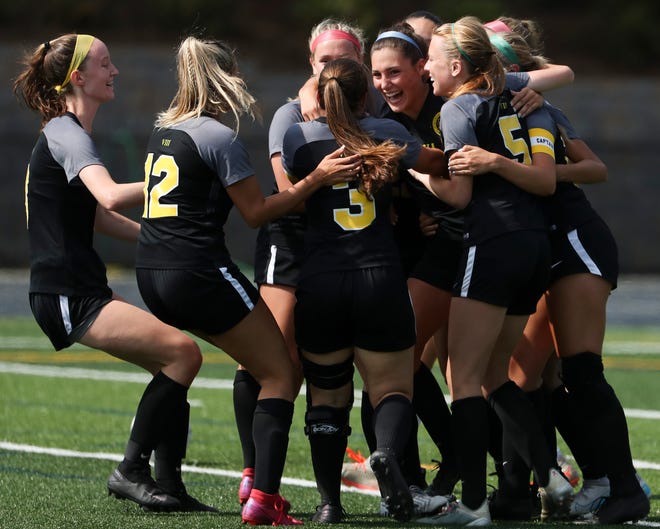 Padua gathers around Madison Mosier (facing camera, center) after she opened the scoring in the first half of the Pandas' 4-0 DIAA DIv. I state tournament semifinal win against Charter School of Wilmington at Abessinio Stadium Tuesday, May 25, 2021.