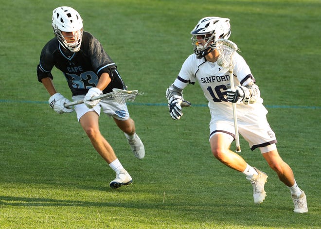 Sanford's James Gaylor (right) is pursued by Cape Henlopen's Finn Forcucci in the second half of the Vikings' 16-15 win at Sanford School in a semifinal of the DIAA state tournament Tuesday, May 25, 2021.