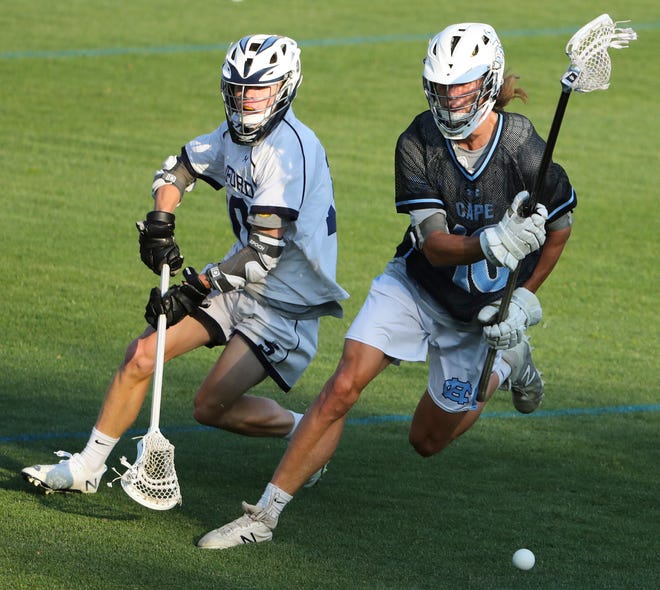 Sanford's Richard Christopher (left) and Cape Henlopen's Drew Dennis move for a loose ball in the second half of the Vikings' 16-15 win at Sanford School in a semifinal of the DIAA state tournament Tuesday, May 25, 2021.
