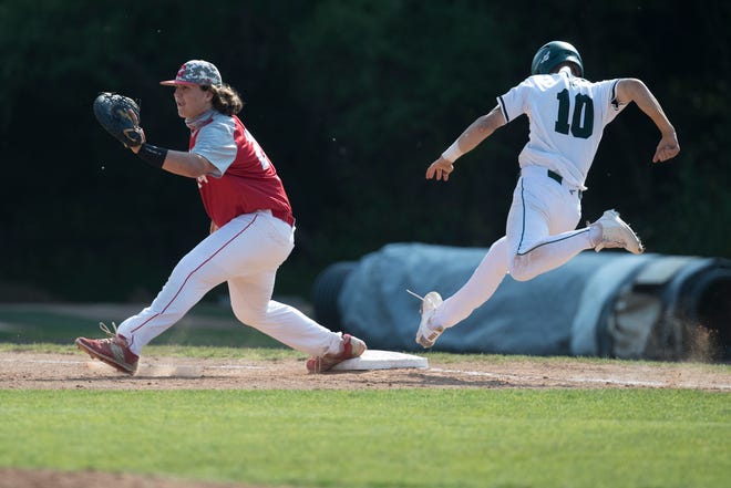 St. Mark's Garrett Quinn, 10, stretches out for first base against Smyrna Tuesday, May 25, 2021. St. Mark's defeated Smyrna 7-0 to advance to the DIAA semifinals.