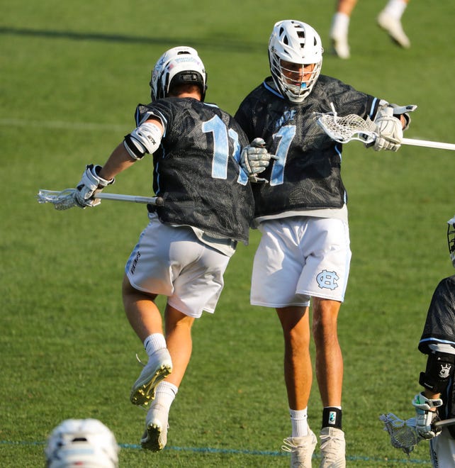Cape's Blae Gipko (left) and Gabriel Best celebrate a score in the Vikings' 16-15 win at Sanford School in a semifinal of the DIAA state tournament Tuesday, May 25, 2021.