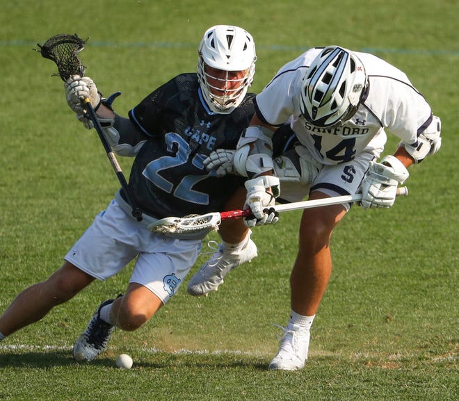 Cape Henlopen's Charles Fritchman (left) fights for the ball on a face-off against Sanford's Timothy Lucky in the Vikings' 16-15 win at Sanford School in a semifinal of the DIAA state tournament Tuesday, May 25, 2021.