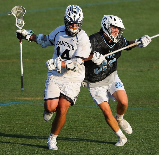 Sanford's Timothy Lucky pushes toward the net against Cape Henlopen's Finn Forcucci in the second half of the Vikings' 16-15 win at Sanford School in a semifinal of the DIAA state tournament Tuesday, May 25, 2021.