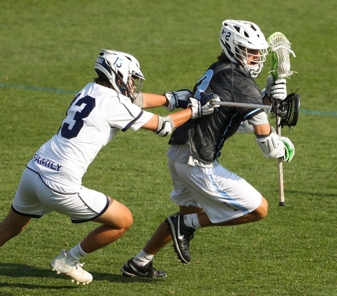Cape Henlopen's Henry D'Ambrogi (right) works against the defense of Sanford's Spencer Zbranak in the first half of the Vikings' 16-15 win at Sanford School in a semifinal of the DIAA state tournament Tuesday, May 25, 2021.