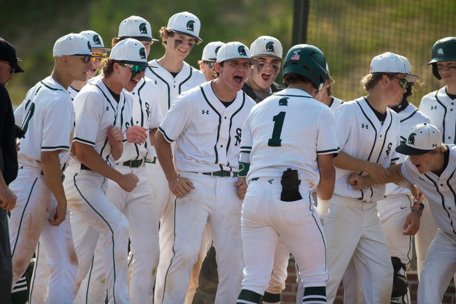 St. Mark's players celebrate with Christian Colmery (1) as he reaches home base after hitting a home run against Smyrna Tuesday, May 25, 2021. St. Mark's defeated Smyrna 7-0 to advance to the DIAA semifinals.