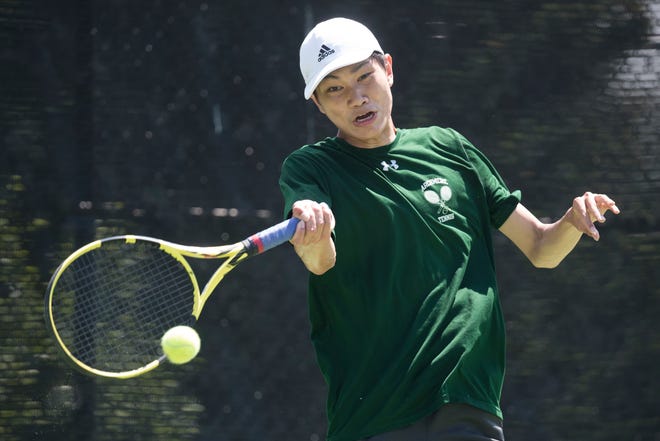 Archmere's Andy Zhu connects with the ball during his match in the DIAA boy's first singles state championship Thursday, May 27, 2021.