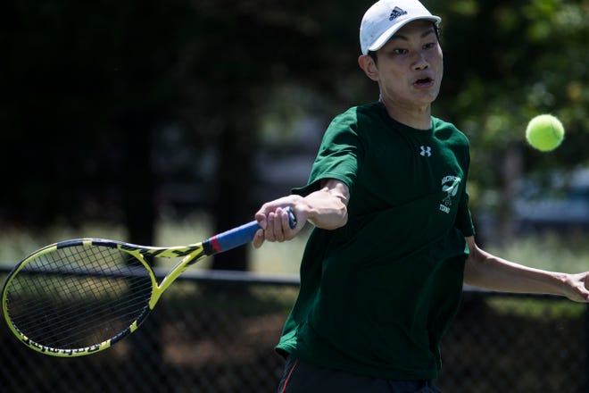 Archmere's Andy Zhu connects with the ball during his match in the DIAA boy's first singles state championship Thursday, May 27, 2021.