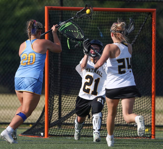 Cape Henlopen's Riley Keen (left) scores past Tatnall goalie Carlie McKenry in the first half of the DIAA state tournament title game Thursday, May 27, 2021 at Dover High School.