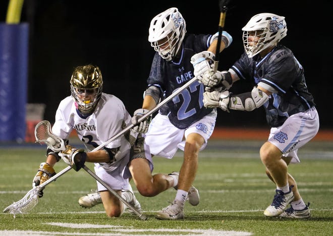 Salesianum's Matthew Riley retains the ball as he is challenged by Cape Henlopen's Landon Best (27) and Charles Fritchman late in the second half of Salesianum's 12-10 win in the DIAA state tournament championship game Thursday, May 27, 2021 at Dover High School.