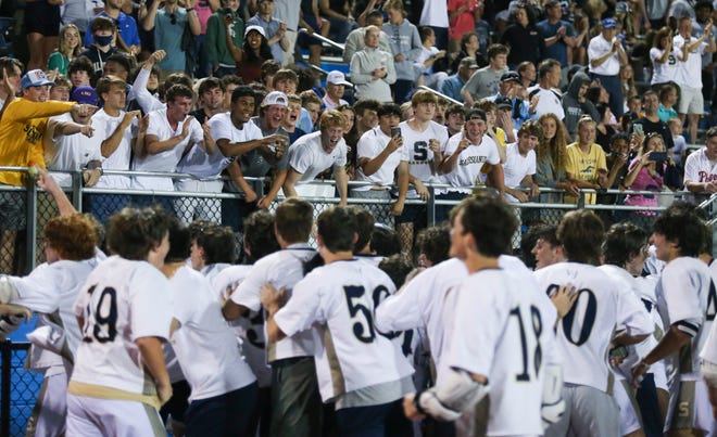 Salesianum surges toward the bleachers and the student section after winning the DIAA state tournament championship game Thursday, May 27, 2021 at Dover High School.