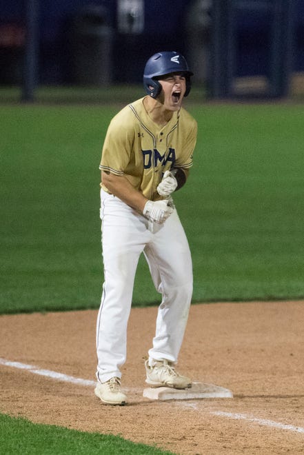 DMA's Mason McCloskey (12) reacts after a big hit in the 7th inning in the DIAA baseball semifinals Thursday, May 27, 2021.