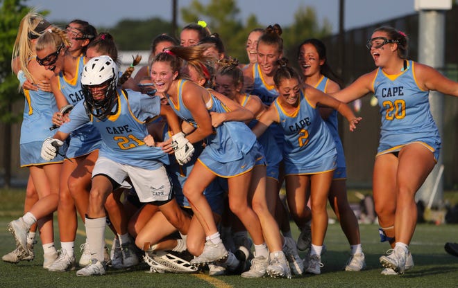 Cape Henlopen converges on goalie Destiny Kusen after the final seconds came off the clock in the Vikings' 17-10 win against Tatnall in the DIAA state tournament championship game Thursday, May 27, 2021 at Dover High School.