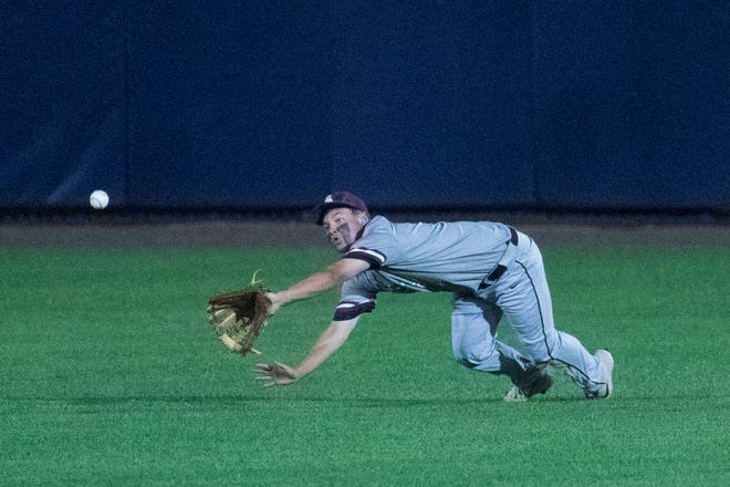 Caravel's Anthony Nardo (6) dives out just short of a hit into deep centerfield in the DIAA semifinals Thursday, May 27, 2021, at Frawley Stadium.
