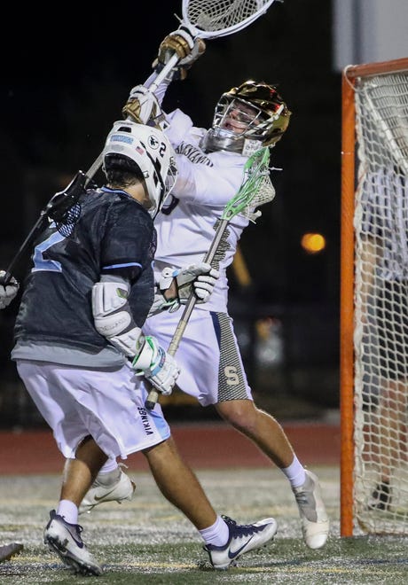 Cape Henlopen's Henry D'Ambrogi dekes a shot at Salesianum goalie Jackson Skinner in the final moments of the second half of Salesianum's 12-10 win in the DIAA state tournament championship game Thursday, May 27, 2021 at Dover High School.