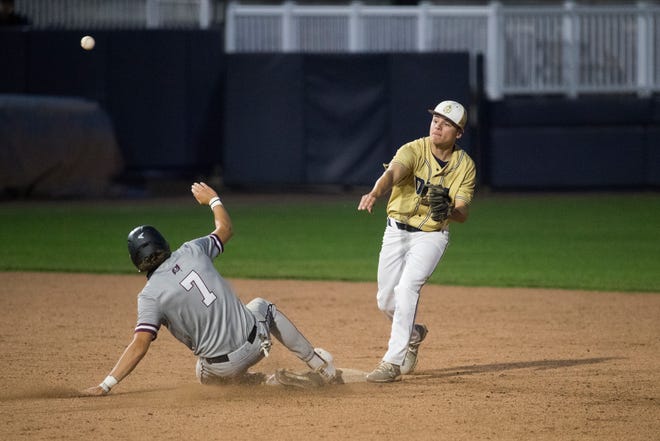 DMA's Joshua Silva (4) throws towards first base as Caravel's David Sterling (7) slides in late in the DIAA semifinals Thursday, May 27, 2021, at Frawley Stadium.