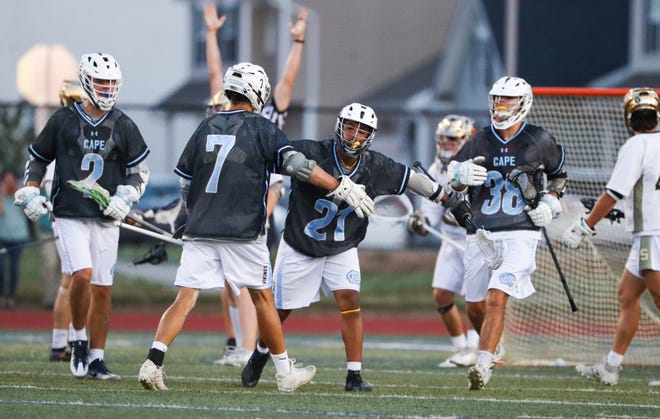 Cape Henlopen's Jaden Davis (21) celebrates a goal with (from left) Henry D'Ambrogi, Gabriel Best and William Bragg in the first half of the DIAA state tournament championship game Thursday, May 27, 2021 at Dover High School.