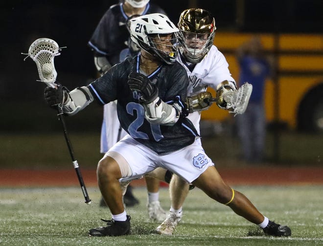 Cape Henlopen's Jaden Davis maneuvers as Salesianum's Connor Lucey defends late in the second half of Salesianum's 12-10 win in the DIAA state tournament championship game Thursday, May 27, 2021 at Dover High School.
