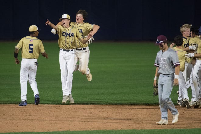 Delaware Military Academy players celebrate a 7th inning 3-2 win over Caravel Academy in the DIAA semifinals Thursday, May 27, 2021, at Frawley Stadium.