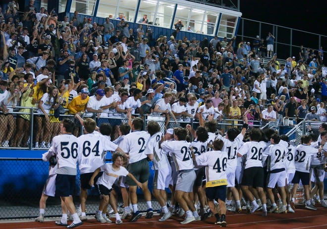 Salesianum surges toward the bleachers and the student section after winning the DIAA state tournament championship game Thursday, May 27, 2021 at Dover High School.