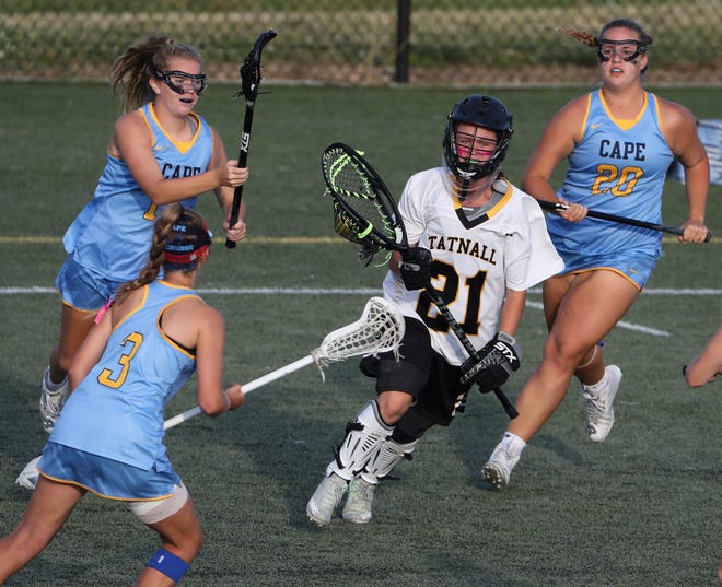 Cape Henlopen's (from left) Haley Craig (3), Kelly Bragg and Riley Keen converge on Tatnall goalie Carlie McKenry in the second half the Vikings' 17-10 win in the  DIAA state tournament championship game Thursday, May 27, 2021 at Dover High School.
