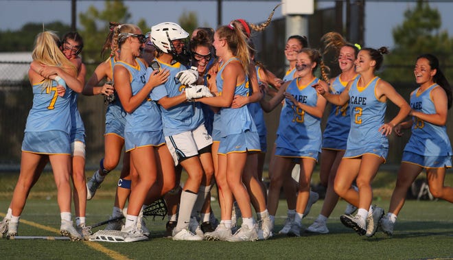 Cape Henlopen begins the celebration after the Vikings' 17-10 win in the DIAA state tournament championship game Thursday, May 27, 2021 at Dover High School.