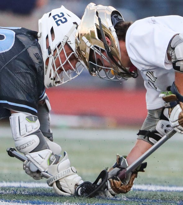 Cape Henlopen's Charles Fritchman (left) and Salesianum's Matthew Riley square off in the first half of the DIAA state tournament championship game Thursday, May 27, 2021 at Dover High School.