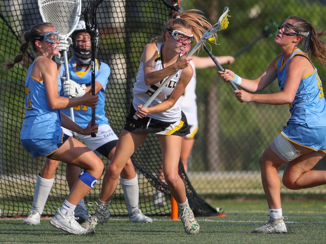 Cape Henlopen's Jocelyn Leach (left) and Emily Monigle converge on Tatnall's Kali Clayton in the first half of the DIAA state tournament title game Thursday, May 27, 2021 at Dover High School.