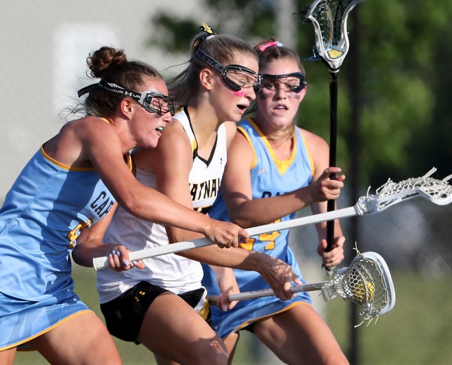 Cape Henlopen's Elizabeth Rishko (left) and Alexi Nowalowski work against Tatnall's Katrina Cattermole in the first half of the DIAA state tournament Thursday, May 27, 2021 at Dover High School.