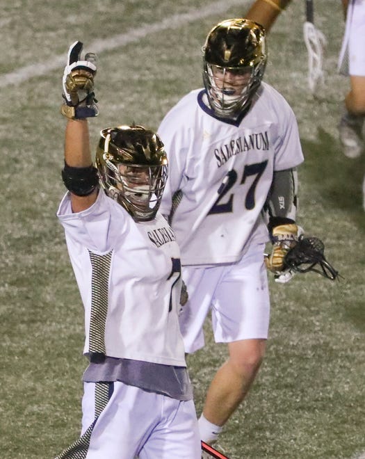 Salesianum's Dylan Mooney reacts after scoring late in the second half of Salesianum's 12-10 win against Cape Henlopen in the DIAA state tournament championship game Thursday, May 27, 2021 at Dover High School. Griffin McGovern (27) joins the celebration.