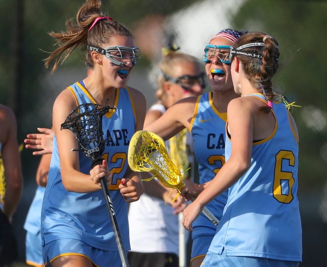 Cape Henlopen's (from left) Lindsay Rambo, Molly Mendes and Louise Rishko come together a goal in the first half of the Vikings' win in the title game of the DIAA state tournament Thursday, May 27, 2021 at Dover High School.