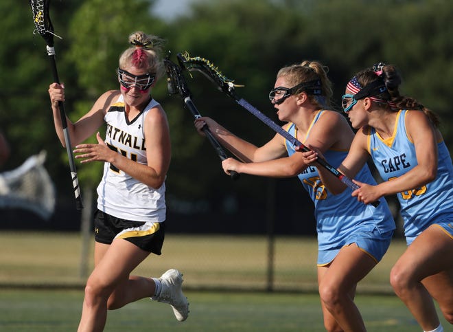Tatnall's Olivia Carpenter (left) is defended by Cape Henlopen's Kelly Bragg (center) and Molly Mendes in the first half of the DIAA state tournament title game Thursday, May 27, 2021 at Dover High School.