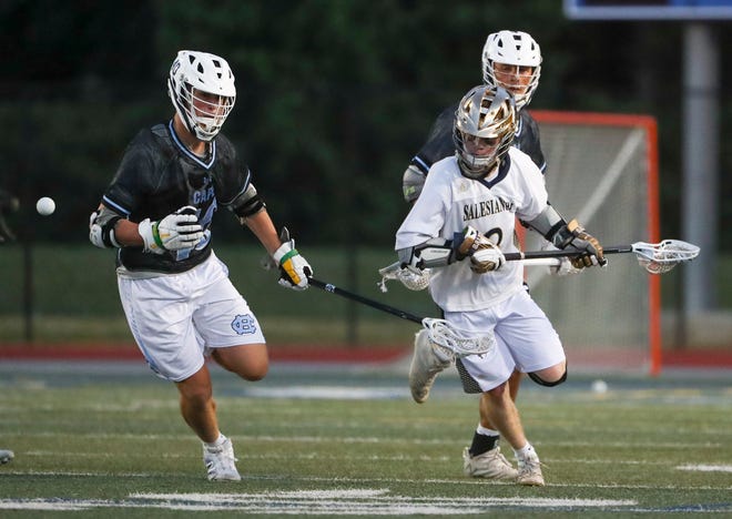 Cape Henlopen's Jacob Schell (left) and Gabriel Best pursue a loose ball with Salesianum's Connor Lucey in the first half of the DIAA state tournament championship game Thursday, May 27, 2021 at Dover High School.